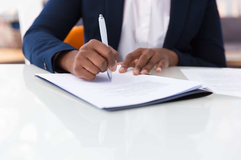 businesswoman filling contract form