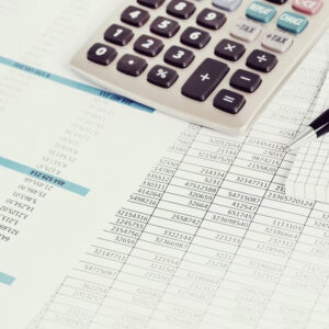 calculator on monthly statement papers