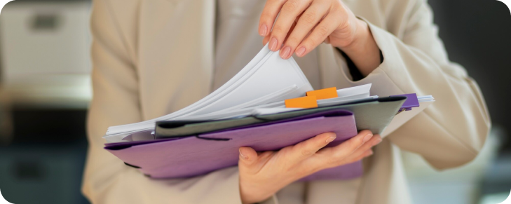 worker carrying office documents