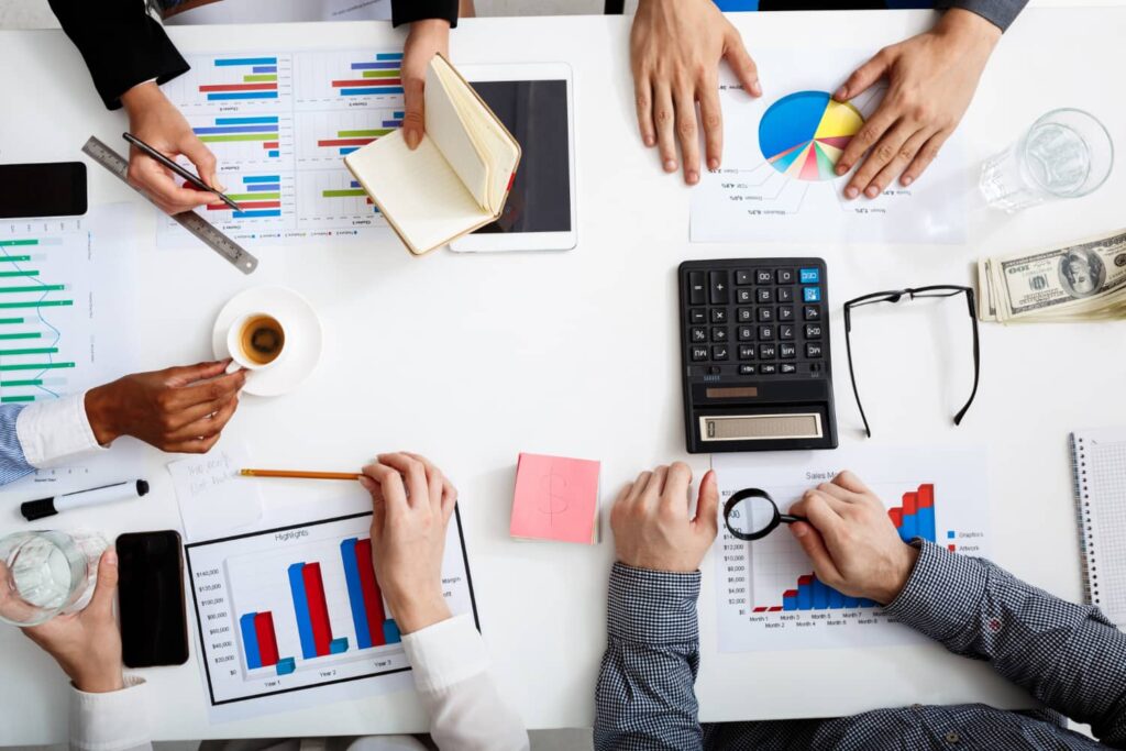 team discussing financial charts