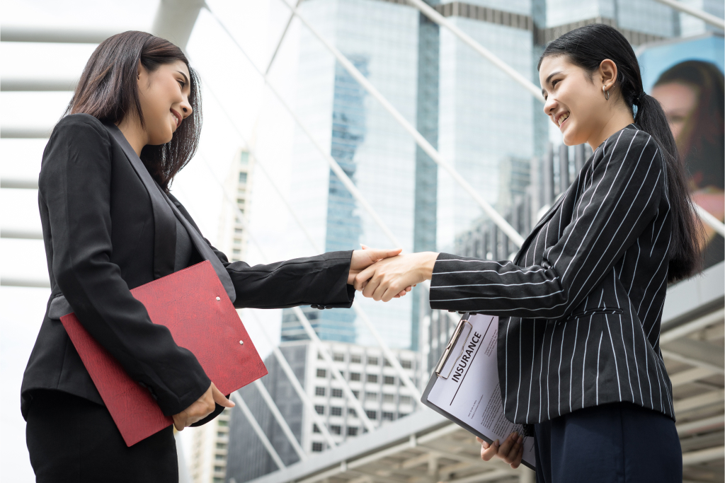 employers shaking hands after agreement
