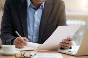Man writing on a piece of paper