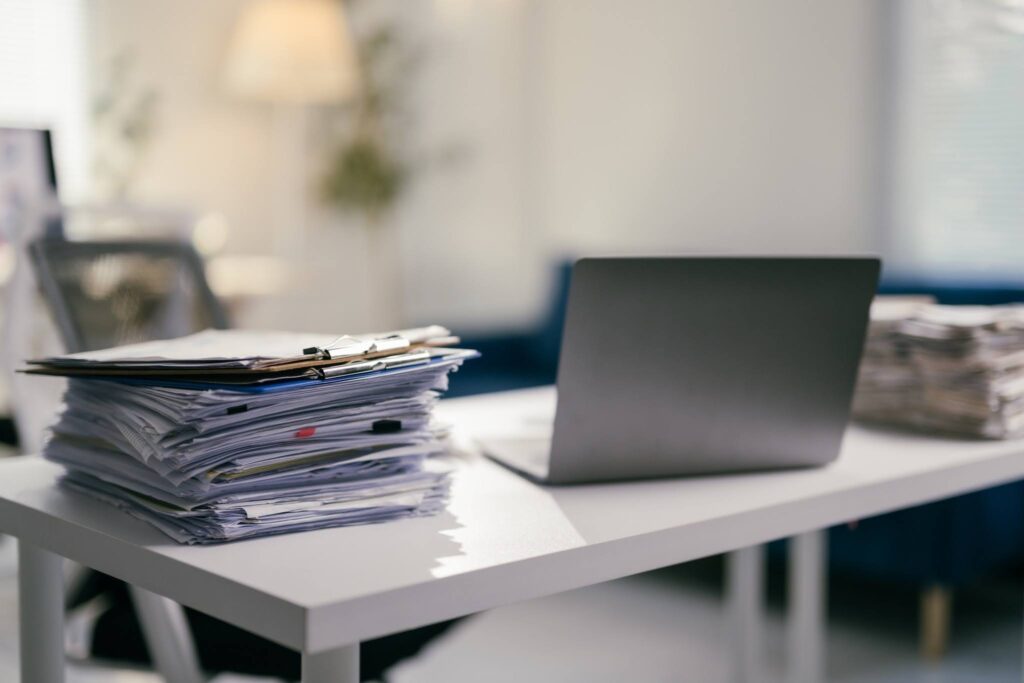 Office desk with corporate tax filing paperwork for Singapore businesses