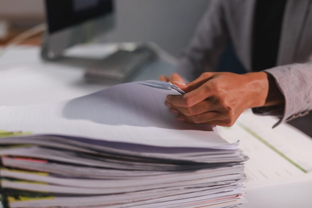 stack of papers with stick notes